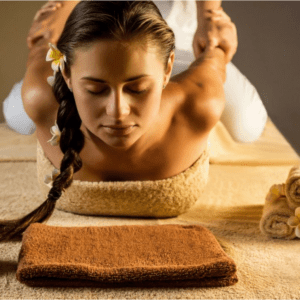 A woman is getting her head shaved by a masseuse.