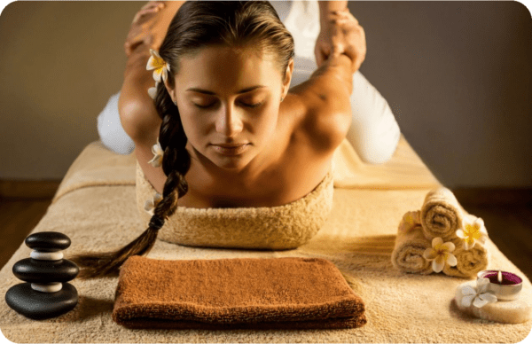 A woman is getting her head shaved by a masseuse.