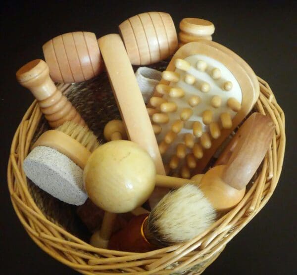 A basket of wooden hair brushes and combs.